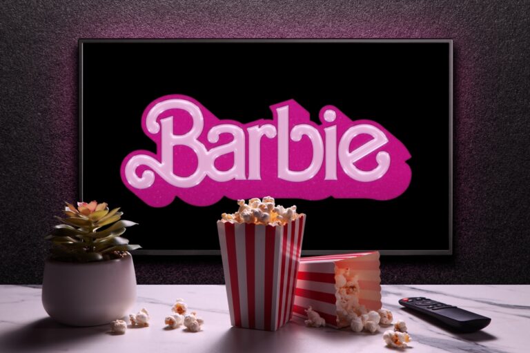 Tv,Screen,Playing,Barbie,Trailer,Or,Movie.,Tv,With,Remote